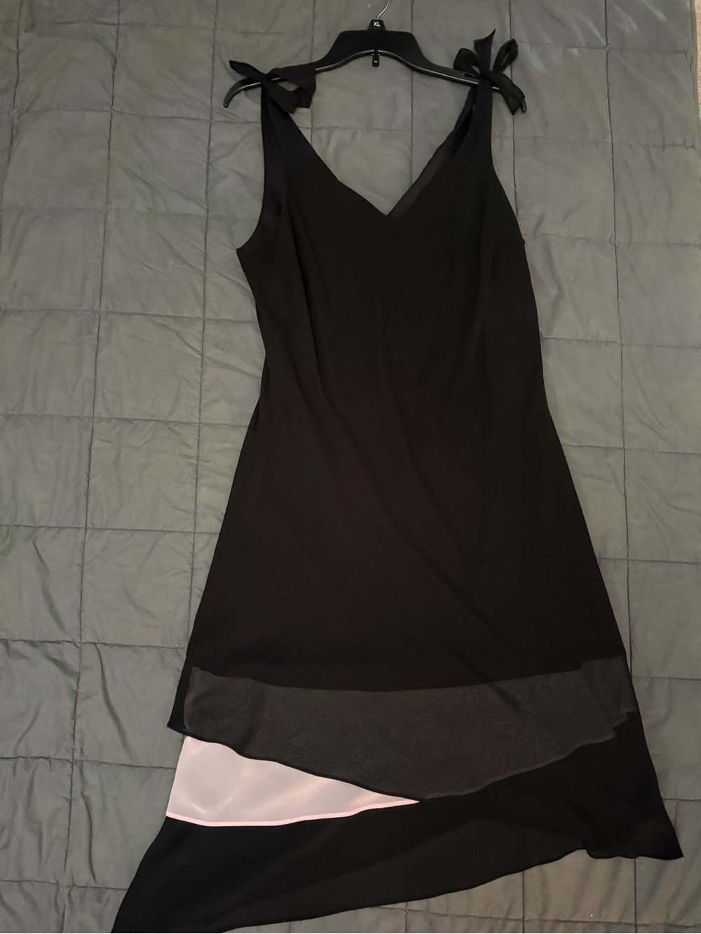 Black and light pink asymmetrical dress with bow detail. Size: 16